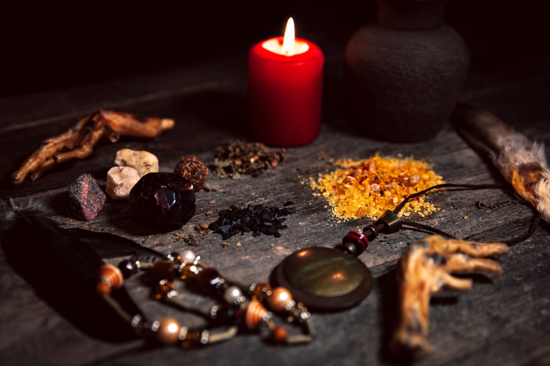 Voodoo or vodun ingredients for an dark ritual, witchcraft and african religion, talisman, incense, crow´s feet and gems Voodoo or vodun ingredients for an dark ritual, witchcraft and african religion, talisman, incense, crow´s feet and gems